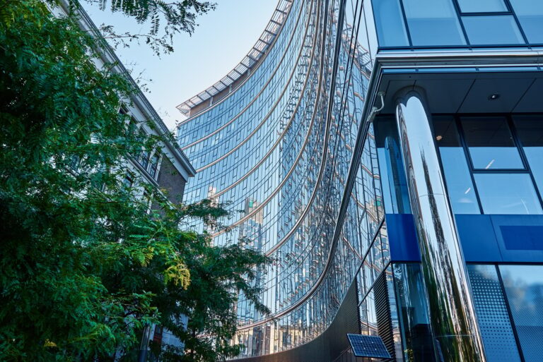 Glass facade of high rise building with geometric lines. Modern architecture